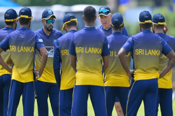 During a practice, Dimuth Karunaratne and Chris Silverwood address the group